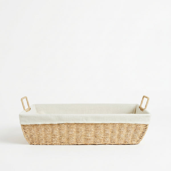 Vooraanzicht van grote naturel boho opbergmand met linnen voering en twee handvatten