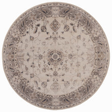 Rond beige vloerkleed Inka 1143 volledig in beeld met donkere sierband en bloemendessin
